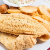 Catfish · Two hand-breaded cornmeal fillets deep fried golden brown served with steak fries, coleslaw ...
