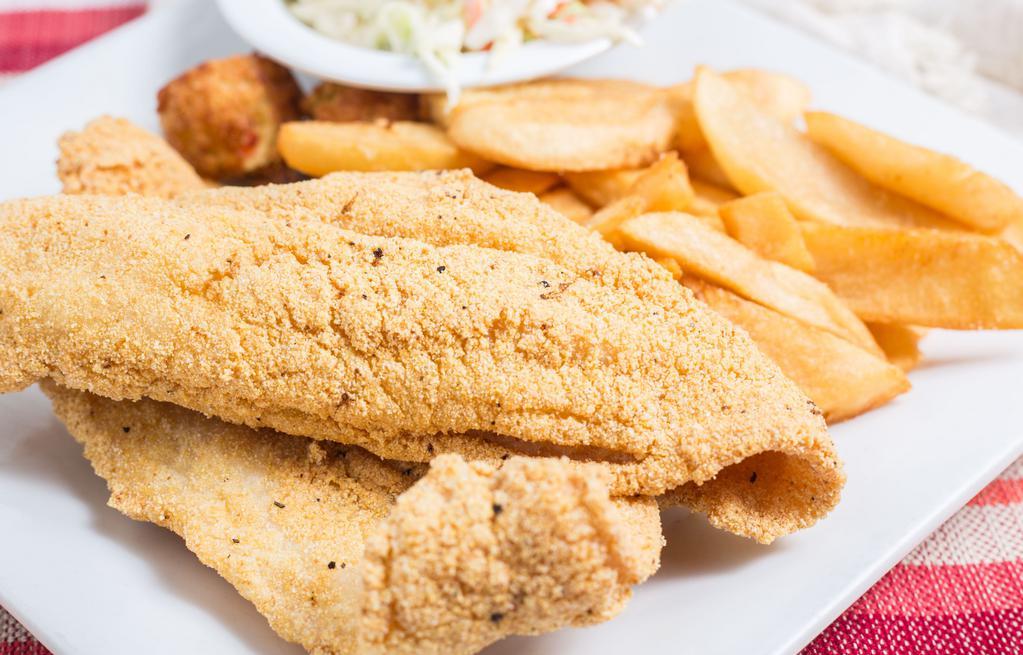 Catfish · Two hand-breaded cornmeal fillets deep fried golden brown served with steak fries, coleslaw and home-made tartar sauce.