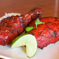 Tandoori Chicken · Tender bone-in chicken, marinated with exotic tandoori spices.Served with side of mint sauce.