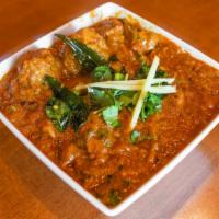 House Special Chicken Curry · Chicken cooked in traditional andhra style with homemade spices.The entry is served with whi...