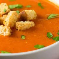 Tomato Cream Soup · served with croutons, pesto, parmesan cheese.