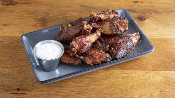 Chicken Wings · Smoked, flash fried, option to be tossed ( dry rub, spicy BBQ, Carolina, or Buffalo)