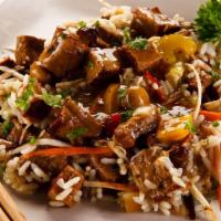 Beef Fried Rice · Classic soy sauce stir-fried rice with bits of succulent beef topped with spring onions.