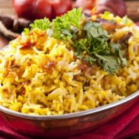 Chicken Biryani · Indian style richly seasoned rice, served with house special tender braised chicken.