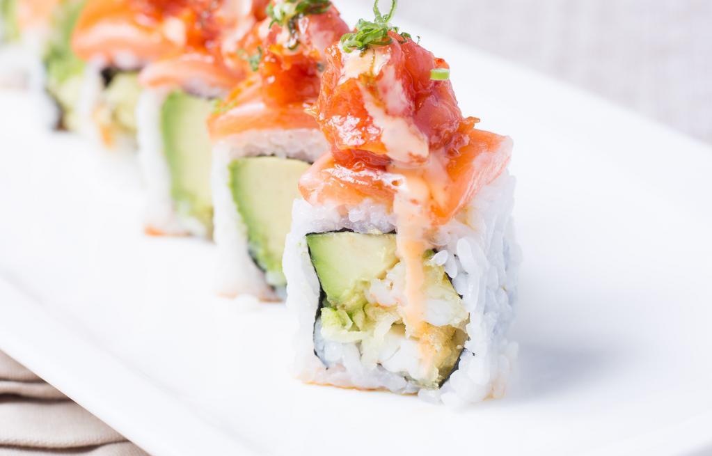 Rainforest Roll · Shrimp tempura, avocado topped with salmon and spicy tuna, spicy mayonnaise, eel sauce, and scallion garnish.