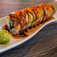 Dragon Roll · Cucumber, avocado, cream cheese crab, shrimp tempura, topped with eel and avocado and three ...