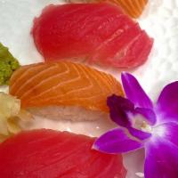 Combo Nigiri · Salmon , yellowtail and red tuna over sushi rice. Side large magaso, total 6 pieces.