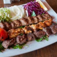 Mix Grill Platter · Comes with three skewers Iraqi bread and salad. Add on entre skewer for an additional charge.