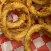 Beer Battered Onion Rings · Texas onions battered in our buttermilk batter with a little shiner bock and fried to a gold...