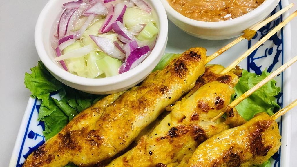 Chicken Satay (4 Pcs) · Grilled marinated chicken on a skewer. Served with sweet Thai peanut sauce, cucumber salad .