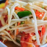 Thai Papaya · Thai - Fresh shredded green papaya tossed with tomatoes, Thai chili, lime, and fish sauce to...