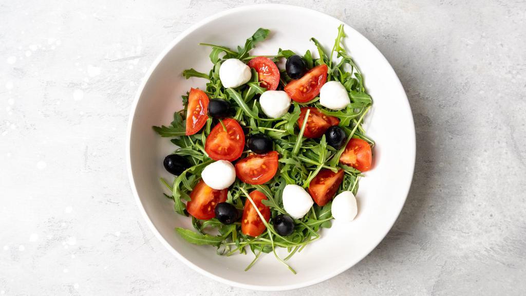 Greek Salad · Arcadian Mix with Fresh Cucumber, Heirloom Tomato, Tasteful Green Bell Pepper, Kalamata Olives, and Feta Cheese. Garnished with Lemon Vinaigrette.