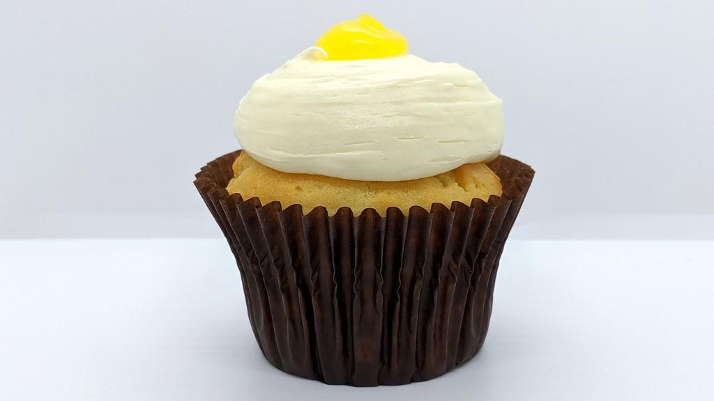 Lemon Drop · Vanilla cake filled with tangy lemon topped with our lemon buttercream and a dollop of tangy lemon.