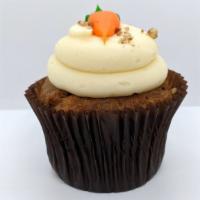 Carrot Cake · Carrot Cake Baked with Pecans and Coconut Frosted with Cream Cheese Icing Garnished with Car...