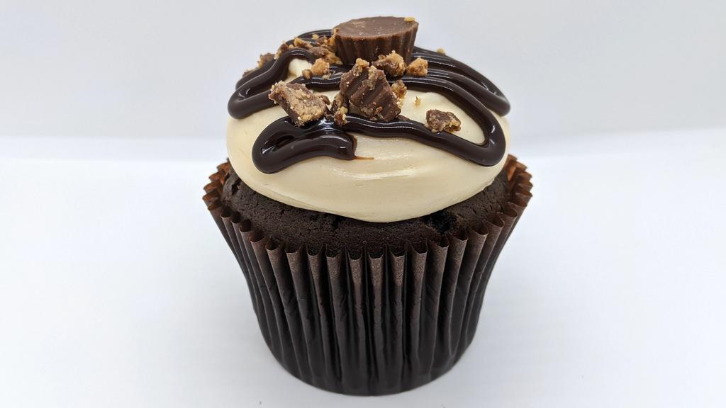 Peanut Butter Cup · Chocolate Cake with Peanut Butter Cream Cheese Icing topped with Peanut Butter Cup Crumbles