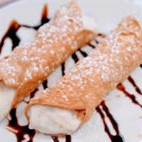 Cannoli · The perfect way to end your meal! Two crispy tube-shaped shells made of pastry dough, filled...