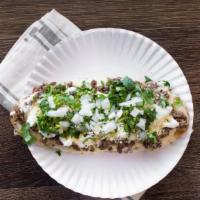 Huaraches · Thick homemade beans in corn tortilla topped with  chiice of meat, cilantro, onion, sour cre...