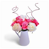 Perfectly Pink  · 1 Dozen Pink and White roses beautifully arranged in a classic white pitcher vase.
