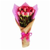 Pink Roses In Burlap · 1 Dozen Pink roses wrapped in a classic burlap wrap tied with a chiffon pink bow.