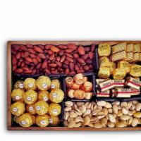 Lotta Nuts · Wooden gift box filled with 
- Almonds
- Pistachios
- Ferrero Rocher
- Merci European Chocol...