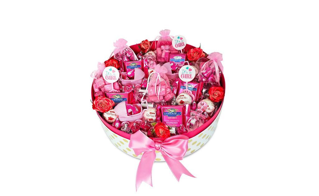 Its A Girl! · Welcome new babies to the world with this adorable chocolate gift box that includes 
- Ferrero Rafaello
- Dark Chocolate Raspberry Ghirardelli Squares
- Hershey's Kisses & Nuggets
- Pink Starburst 
- Assortment of Flowers