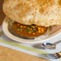 Chana Batura · Puffy bread with chickpeas, Punjabi curry.