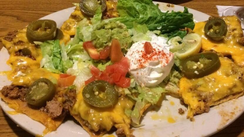 Mexicali Nachos · With beef or chicken, beans, cheese, guacamole, sour cream, lettuce, tomatoes and jalapeno peppers.