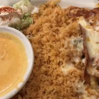 Chimichanga · Large flour tortilla stuffed with chicken deep-fried, covered with ranchero sauce and served...