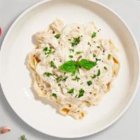 Alley Alfredo Pasta (Fettuccine) · Fresh fettuccine pasta served with a creamy alfredo sauce.