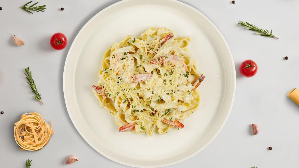 Creamy Alfredo Shrimp Pasta (Fettuccine) · Fresh fettuccine pasta served with a creamy alfredo sauce and shrimp.