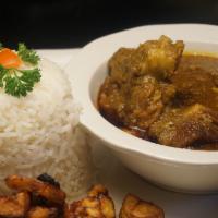 White Rice With Stew · White rice with stew is a classic West African dish made from boiled parboiled long grain ri...