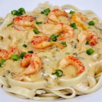 Cajun Fettuccine Alfredo · Creamy three cheese blended alfredo sauce with the perfect amount of seasoning and choice of...