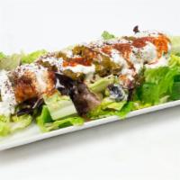 Falafel Salad · Grilled Falafel over a bed of greek salad, house dressing, yogurt sauce, cilantro sauce, and...