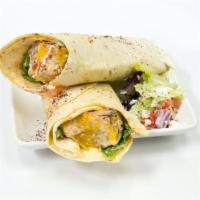 Chicken Kebab Wrap · Chicken Kebab wrapped up in a lavash bread along with spring mix, tomatoes, onions, yogurt s...
