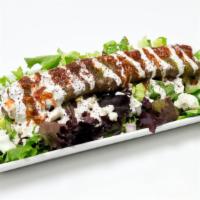Beef Kobida Kebab Salad · Beef Kobida Kebab over a bed of greek salad, house dressing, yogurt sauce, cilantro sauce, a...