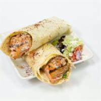 Salmon Kebab Wrap · Salmon Kebab wrapped up in a lavash bread along with spring mix, tomatoes, onions, yogurt sa...