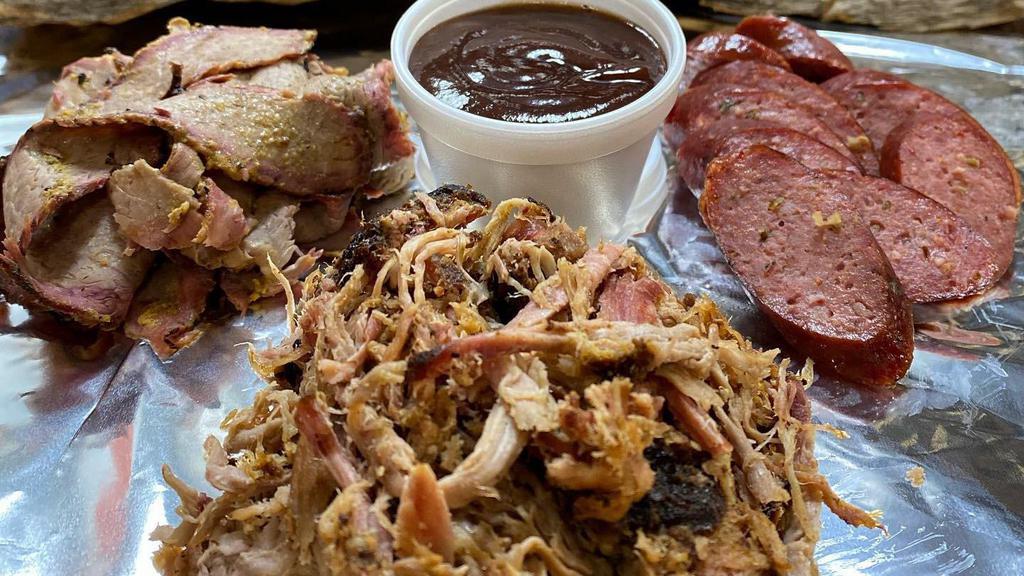 Lone Star State Plate (1Lb) · 1/3 lbs Brisket, 1/3 lbs Sausage, 1/3 lbs Pulled Pork, and a 4 oz sauce of your choice