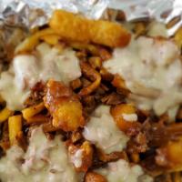 Poutine · Fresh hand-cut fries loaded with our signature brisket gravy and topped brisket queso. **fri...