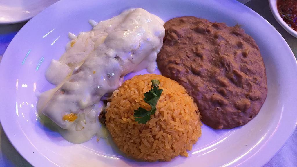 Enchilada Plate Lunch · Choice of 2 enchiladas: Veggie, cheese, chicken, beef or brisket with rice and beans.