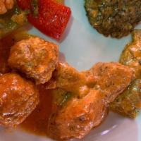 Chicken Vindaloo · Chicken cooked in hot, spicy sauce with potatoes