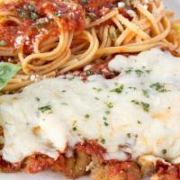 Veal Parmigiana · Tender veal, breaded and topped with marinara sauce and mozzarella cheese