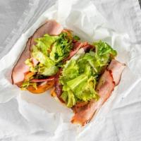 Italian Sub · Deli sliced ham & salami, lettuce, tomatoes, red onions, marinated pepperoncinis, your choic...
