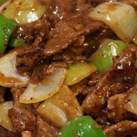 Pepper Steak With Onions · With white rice.