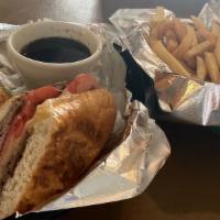 French Dip · House roasted beef, melted provolone and a side of au jus.