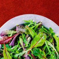 Garden Green Salad · Organic mixed greens tossed with fresh tomatoes, red onions, mushrooms, green peppers with a...