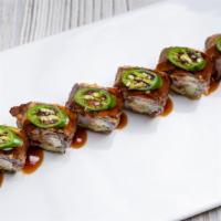 My Lonestar Roll · A delicious blend of crabmeat, cream cheese avocado. inside, certified Angus beef on top wit...