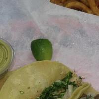 Taco Plate · Choice of pinto or black beans choice of rice white rice or Mexican rice and 3 Taco. Comes W...