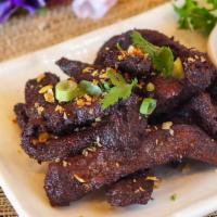 Beef Jerky · Thai Style beef jerky served with chili sauce