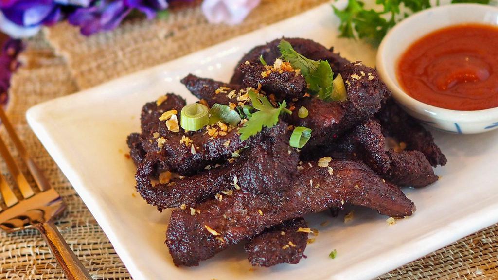 Beef Jerky · Thai Style beef jerky served with chili sauce