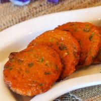 Fish Cakes · Quantity of four. Mixed fish meat with red curry, lime leaf, and Thai spice. Serve with cucu...